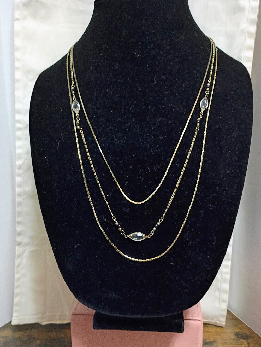 Gold Toned layered necklace with clear crystal beads and silver accents